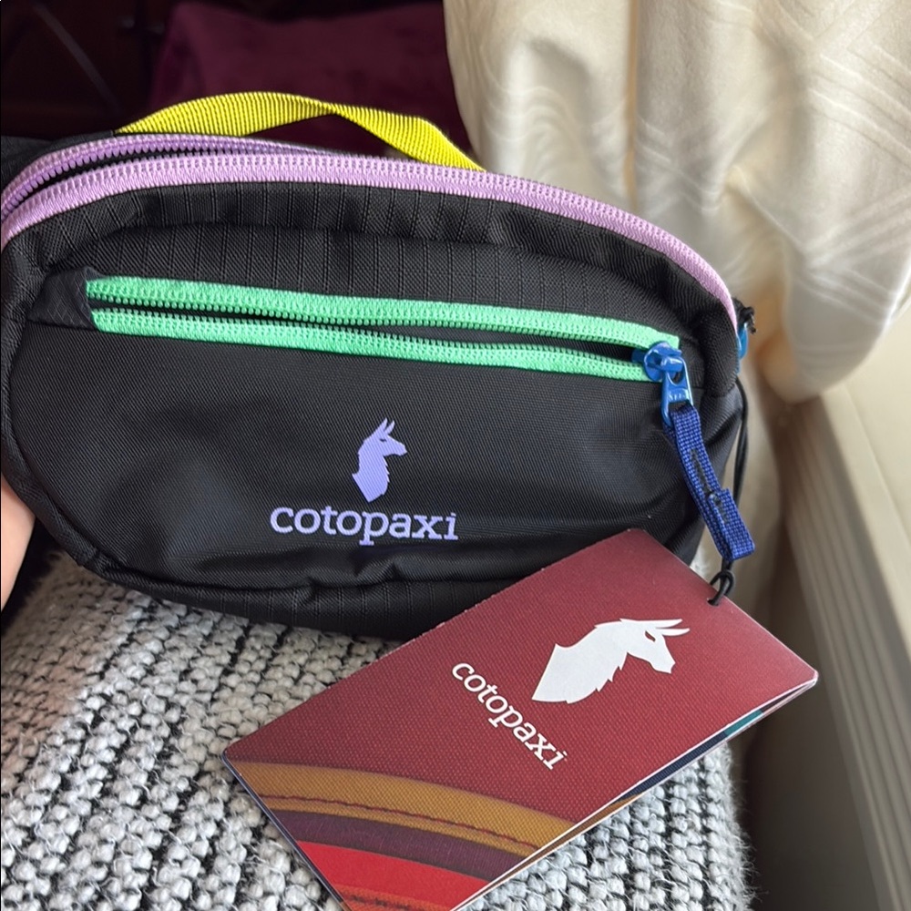 Cotopaxi Black Mini Bag with Multicolor Zippers